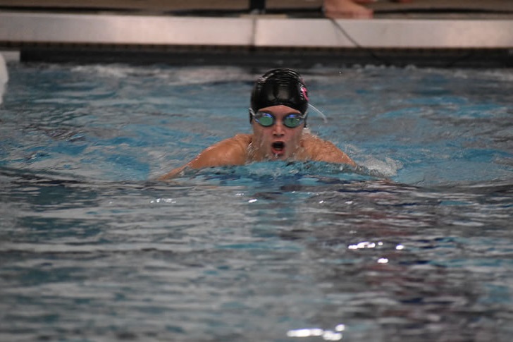 Freshman Ryann Grasser takes a breath during breaststroke.
