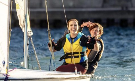 Julia Overmyer and Aidan Soule pose for a picture while on the water.  