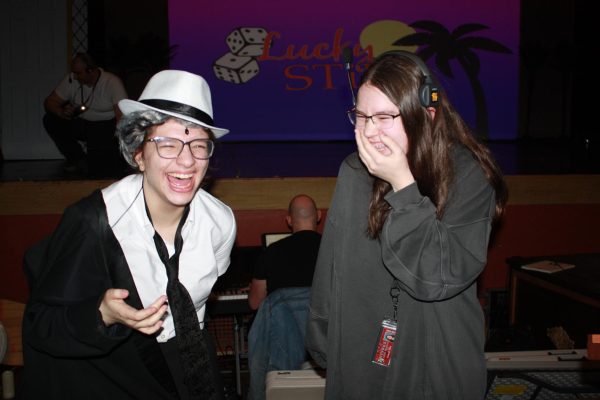 Freshmen Molly Ellis, left, and Turner Riordan, right, laugh during a tech week rehearsal. photo courtesy of Jagoda Porebski